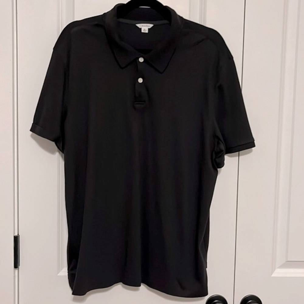 Calvin Klein black men’s polo shirt, size XL.